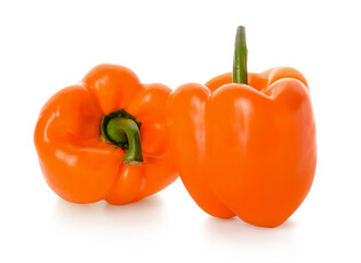 Fresh orange bell peppers isolated on white background