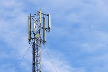 Telecommunication tower with blue sky background. Technology and communication