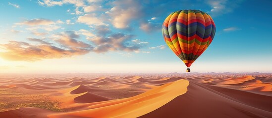 Beautiful desert scenery with a hot air balloon in Sahara Morocco