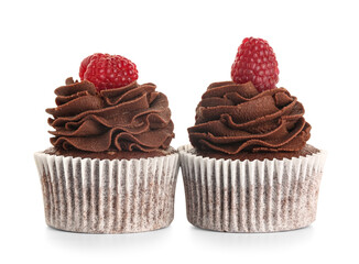 Tasty chocolate cupcakes with raspberries on white background