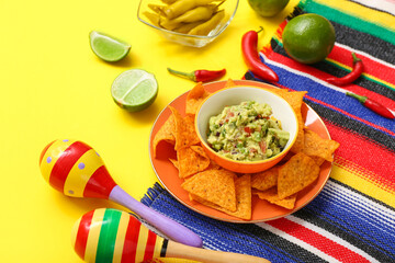 Mexican food, maracas and sombrero on yellow background. Mexico's Independence Day celebration