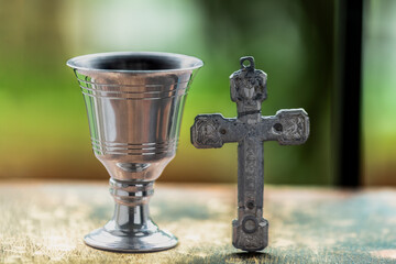 Eucharist mass in the sacrament of the eucharist cup with christian and religious cross