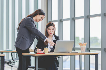 Asian professional successful female businesswoman supervisor mentor in formal suit standing...
