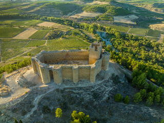 Aerial view of Davalillo castle above the Ebro river in Rioja Spain, with semicircular towers and...