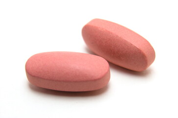 several vitamin B complex pills macro isolated on white Background