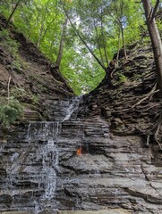 The Eternal Flame in New York. A small flame in grotto under a waterfall. 