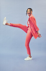 Woman, fashion and excited for kick and style with cosmetics and moving in studio. Trendy, stylish...