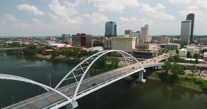 Tilt-up aerial over Broadway Bridge crossing Arkansas River, skyline downtown Little Rock, Arkansas, USA
