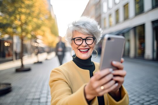 Elderly lady flaunting selfie on phone, with short gray hair, in city. Photo generative AI