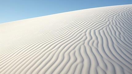 Fototapeta na wymiar A serene white sand dune against a vibrant blue sky
