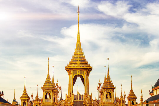 Thailand Royal Crematorium. the golden royal pyre temple padoga for royal funeral of His Majesty King Bhumibol Adulyadej is tourist attraction landmark in Bangkok destination with cloudy sunrise sky b