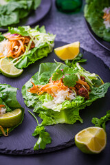 Asian minced meat lettuce wraps with rice, bean sprouts and cabbage