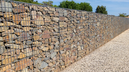 background wall gabion fence steel metal grated stone wall basket mason made urban facade stones