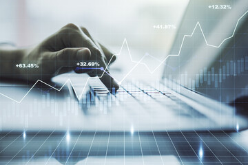 Multi exposure of abstract financial diagram with hand typing on computer keyboard on background,...