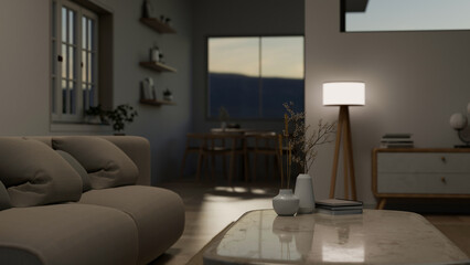 Close-up image of a space on a coffee table in a modern and comfortable living room in the evening.
