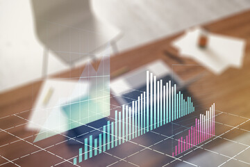 Multi exposure of abstract creative financial graph and modern desktop with computer on background,...