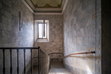 corridor with stone wall in an abandoned house