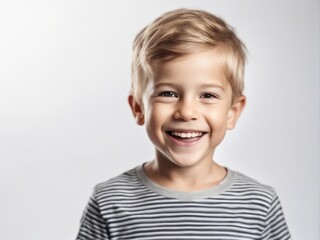 Portrait of young excited laughing smiling boy child kid on studio background
