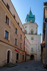 Fototapeta na wymiar Architecture of Lublin Old Town, Lesser Poland. View of traditional colored tenements houses on central streets of Polish city of Lublin in sunny spring day