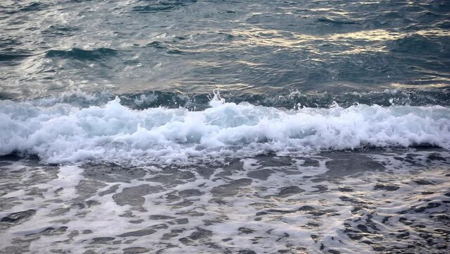 Close Up Ocean Waves Splashing on Beach in Slow Motion at Looc Bay, Philippines.