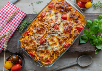 Tuna casserole or tuna pasta bake with macaroni noodles creamy tomato sauce and mozzarella cheese