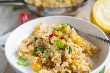 Vegetable rice with yellow zucchini, chili peppers and chives. Cooked with brown rice. Healthy gluten free side dish