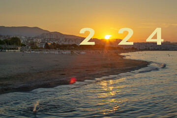 Beach and city view at sunset. 2024 text with sun. new year concept.