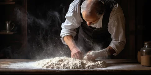 Selbstklebende Fototapeten Man dusting flour onto a baking dough. © Marharyta