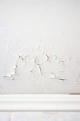 Swelling leaking of whitewash and plaster on ceiling of dwelling due to penetration of water from...