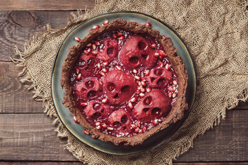 Halloween food. Homemade pie with jam and scary skull-shaped pears. Creative treat for Halloween party. - obrazy, fototapety, plakaty