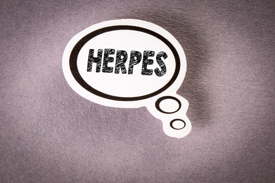 HERPES. Speech bubble with text on gray background