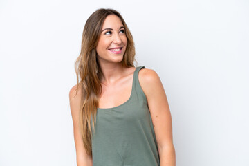 Young caucasian woman isolated on white background thinking an idea while looking up