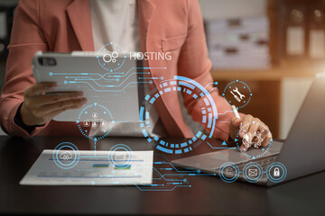 Woman using computer, tablet and presses his finger on the virtual screen inscription Hosting on...