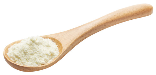 Wooden spoon filled with milk powder