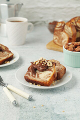 	
A piece of marble biscuit with chocolate cream and nuts