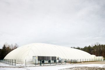 Inflatable air dome stadium. Inflated Football soccer air dome. Modern architecture example...