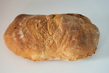 Homemade sourdough bread on white background. Sourdough bread isolated on white background, side photo.