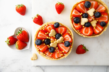 Homemade tarts with strawberry and blueberry