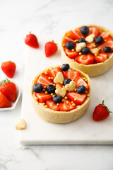 Homemade tarts with strawberry and blueberry