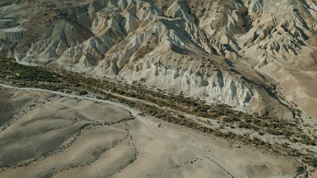 Negev Desert, Israel. Video shooting by drone 4K. Shooting at sunset, near David and Paula Ben Gurion gravesite. Panoramic desert landscape over mountains, sandy hills and rock formations.