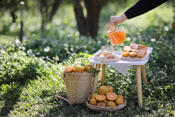 Orange juice on Orange Garden backgound in sunrise