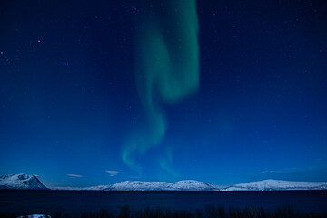 aurora borealis in the mountains and lake