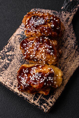 Delicious juicy fried chicken with sweet and sour teriyaki sauce and sesame seeds