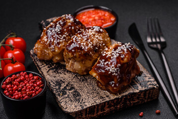 Delicious juicy fried chicken with sweet and sour teriyaki sauce and sesame seeds