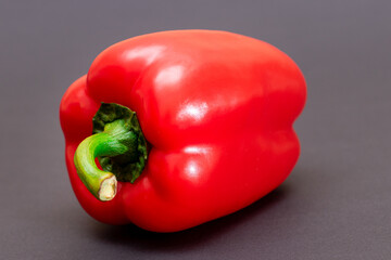 Fresh Red Sweet Bell Pepper on Black Background