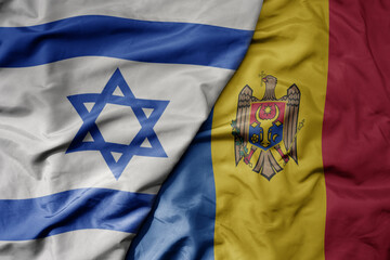 big waving national colorful flag of israel and national flag of moldova .
