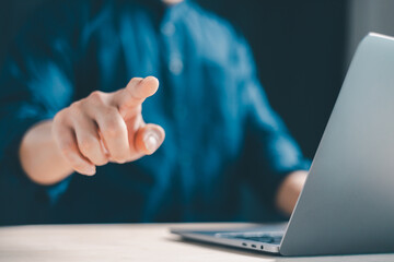 Concept of using technology in communication.Close-up A businessman working on his laptop in the...