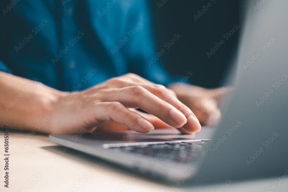Poster concept of using technology in communication.close-up a businessman working on his laptop in the off