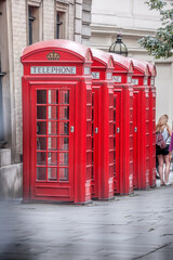 Famous red telephone booths in Covent Garden street, London, England, United Kingdom - 650163038