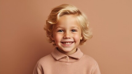 A blond-haired boy posing against a light beige background.